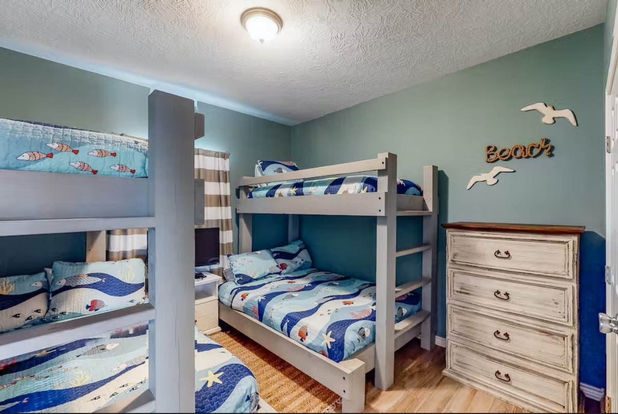 Beach-themed bedroom with bunk beds