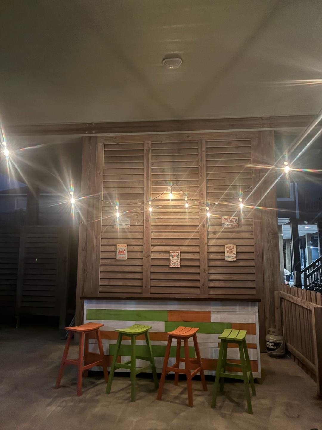 Outdoor covered patio with bar and gas grill